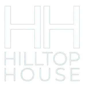 a neon sign that reads hh hotel guests